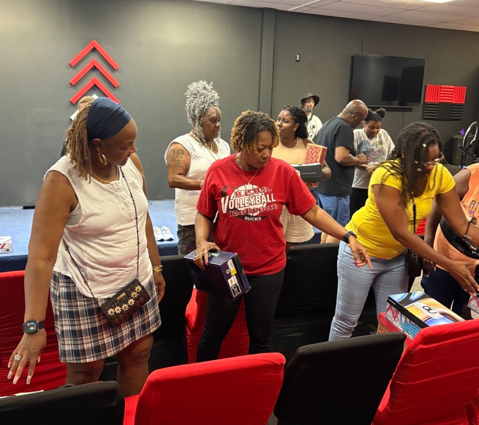 Families choosing shoes and school supplies at Advance Church backpack drive