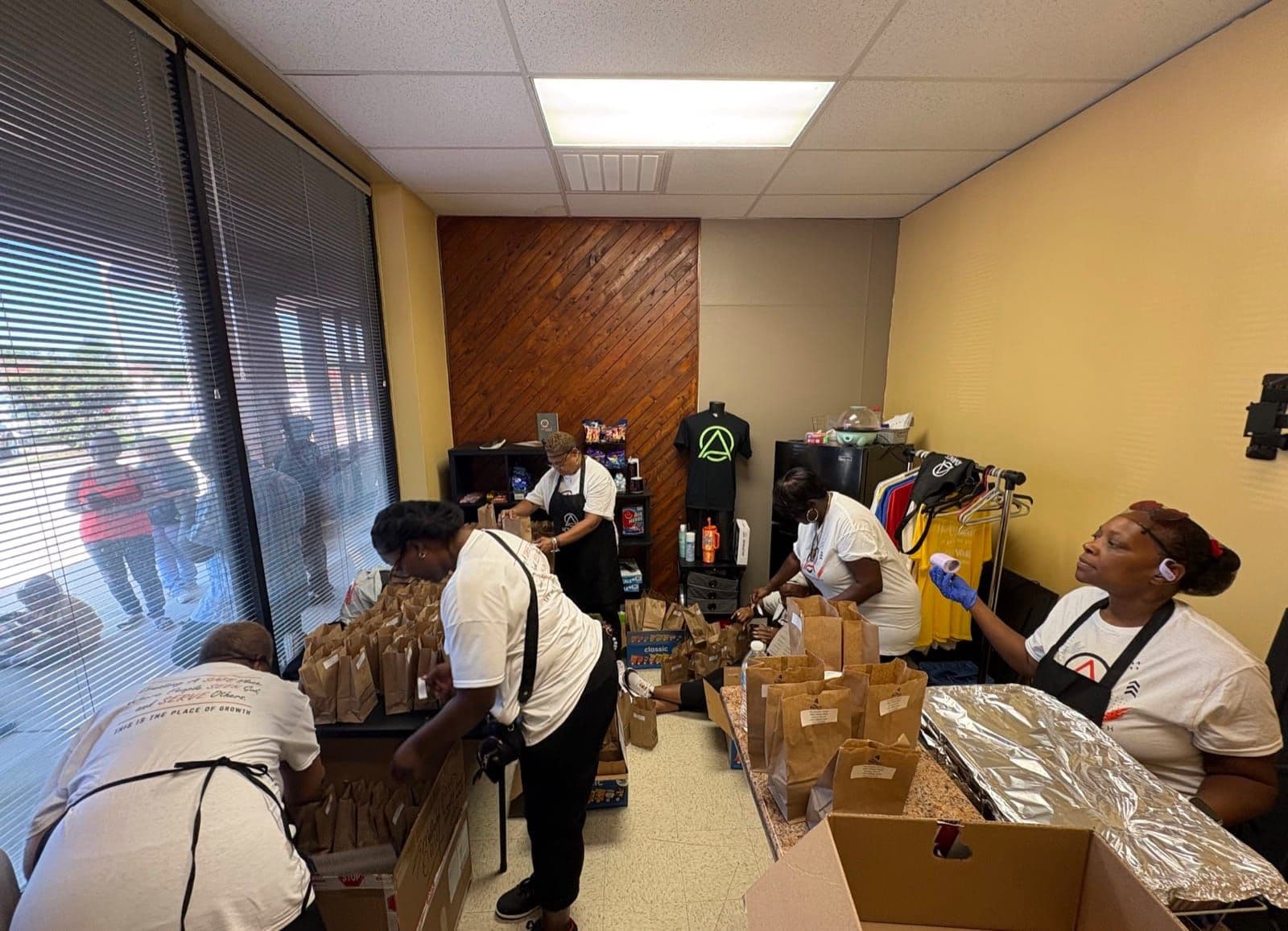 Advance Church volunteers packing bags for the back-to-school backpack drive
